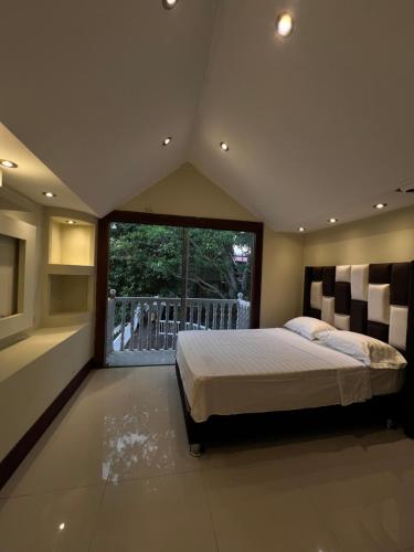 Ένα ή περισσότερα κρεβάτια σε δωμάτιο στο Castillo Yarinacocha