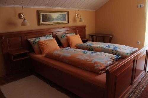 a bed with two pillows on it in a room at Holiday home in Bekesszentandras 20542 in Békésszentandrás