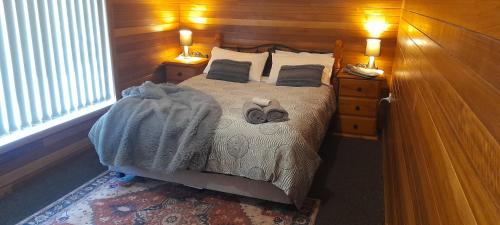 Ένα ή περισσότερα κρεβάτια σε δωμάτιο στο Amazing Ansons Bay remote paradise for the family in the Bay of Fires area