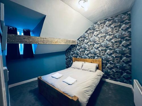 Ένα ή περισσότερα κρεβάτια σε δωμάτιο στο The Maisonette central Buxton