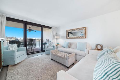 a living room with a couch and chairs at Wind Drift North 211-NEW-Bayfront-Beach access-Boat Slips-Sleeps 8 in Orange Beach