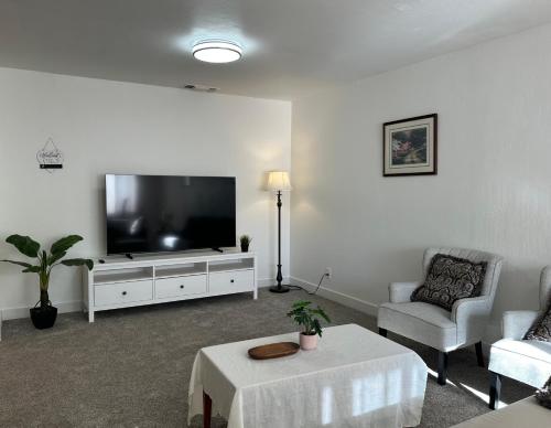 a living room with a large flat screen tv at 2 bedrooms in downtown easy parking in Sacramento