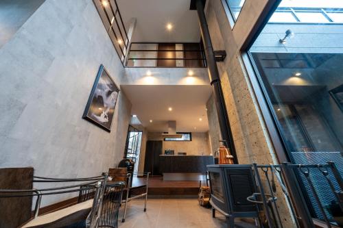 a hallway of a building with a large window at RIVER VIEW HOUSE-Sauna- in Nasushiobara