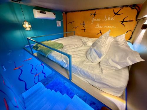 Ένα ή περισσότερα κρεβάτια σε δωμάτιο στο TT Premium Hostel Vientiane