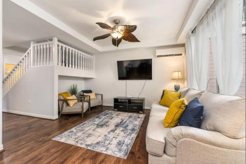 a living room with a couch and a ceiling fan at Luxury Villa Paradise Home in Honokai Hale