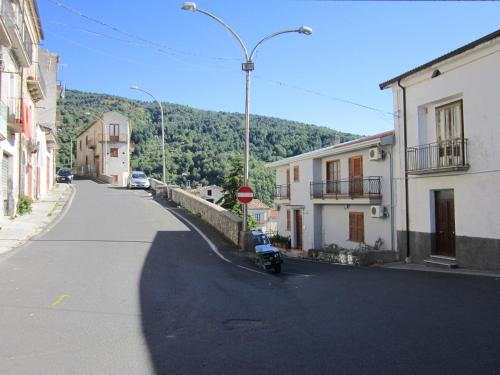 a street with a motorcycle parked on the side of the road at B&B Il Nido dell'Aquila in San Donato di Ninea