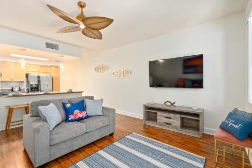 a living room with a couch and a flat screen tv at Luxury Oasis Resort Villa in Honokai Hale