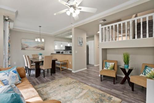 a living room with a couch and a dining room at Serene Oasis - Home Away from Home in Honokai Hale