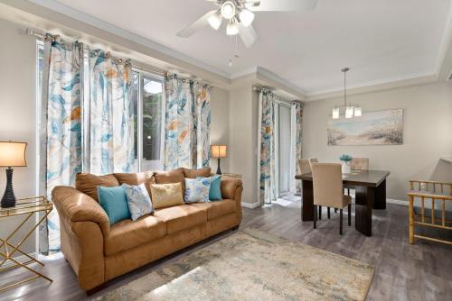 a living room with a couch and a table at Serene Oasis - Home Away from Home in Honokai Hale