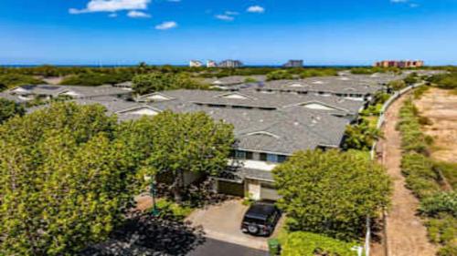 an overhead view of a building with a parking lot at Beautiful 3 Bedroom Villa in Honokai Hale