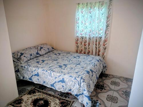 a small bedroom with a bed and a window at BtC Apartments St Paul's in Saint Paulʼs