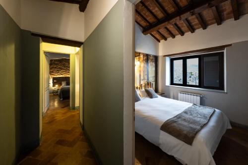 Ένα ή περισσότερα κρεβάτια σε δωμάτιο στο Agriturismo Podere Pietraluna