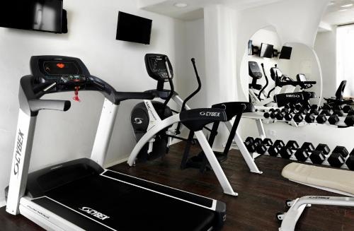 a gym with several exercise bikes in a room at Kensho Ornos in Ornos