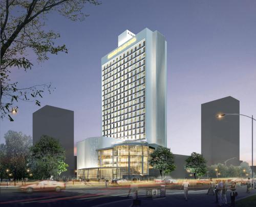 a rendering of a tall building in a city at Garden Palace Hotel in Surabaya