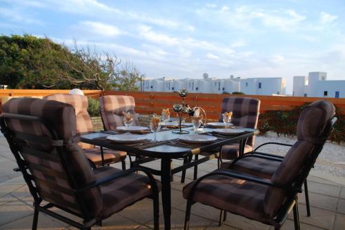 a black table and chairs on a patio at Villa Vista in Paphos City
