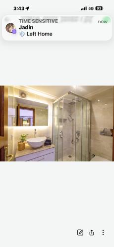 a bathroom with a shower and a sink at PEMBE in Kalkan