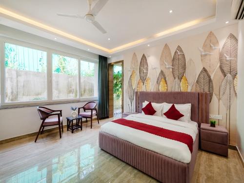 a bedroom with a large bed with red pillows at Villa Vana by DanCenter in Arpora