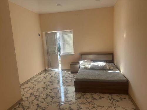 Ένα ή περισσότερα κρεβάτια σε δωμάτιο στο Garden Guesthouse