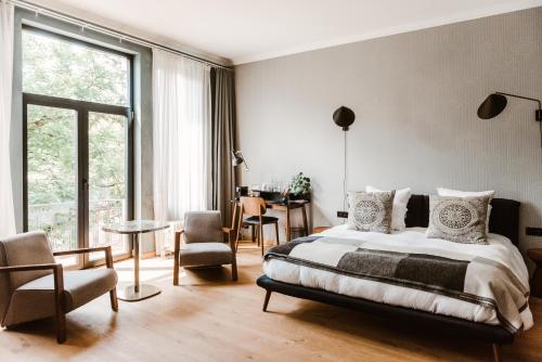 Postel nebo postele na pokoji v ubytování Boutique Hotel Marie Marie