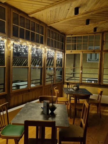 a dining room with tables and chairs and lights at Ansitz Thierburg Suites in Merano