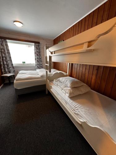 En eller flere senge i et værelse på Ustedalen Lodge, Appartement 1