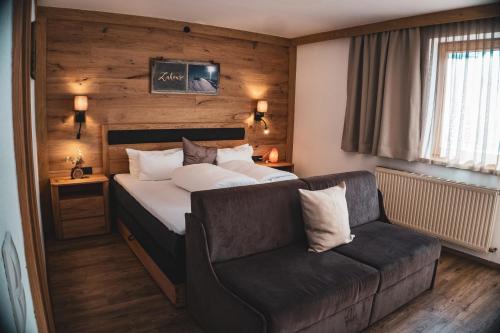 Ένα ή περισσότερα κρεβάτια σε δωμάτιο στο Haus Astoria