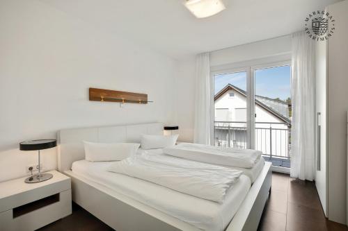 Ένα ή περισσότερα κρεβάτια σε δωμάτιο στο Markgraf Apartments Haus 3