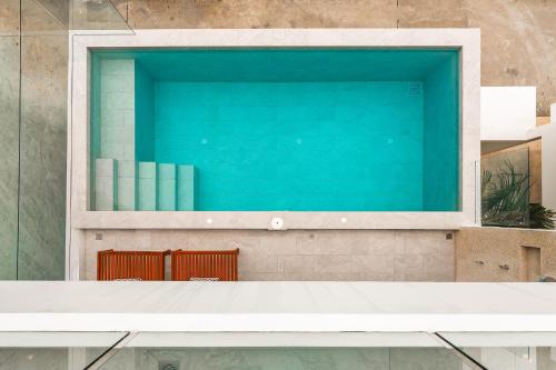 a window on a wall with books on it at Staylar Sunrise Villas - Chaweng Noi, Koh Samui in Amphoe Koh Samui