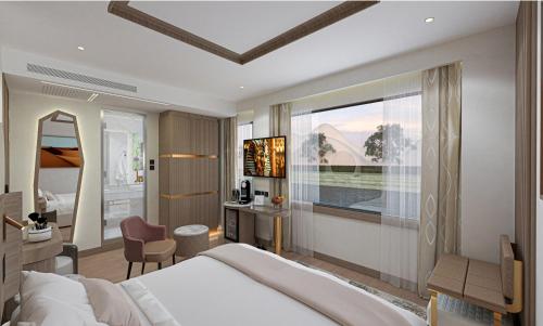 ein Hotelzimmer mit großem Bett und Schreibtisch in der Unterkunft Sola Dahabiya Nile Cruise Every Monday from Luxor to Aswan 4 nights and Every Friday from Aswan to Luxor 3 nights in Luxor