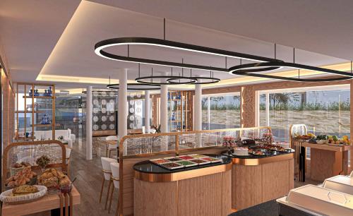 ein Restaurant mit einer Theke mit Essen darauf in der Unterkunft Sola Dahabiya Nile Cruise Every Monday from Luxor to Aswan 4 nights and Every Friday from Aswan to Luxor 3 nights in Luxor