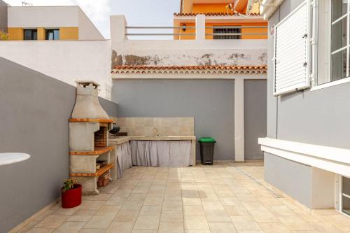 a kitchen with a sink and a counter at Escape To your Private Pool, Sea Views and Bbq in Jinámar