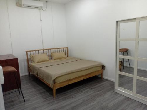 Postel nebo postele na pokoji v ubytování Pacific Fitness Apartments