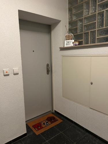 a white door in a room with a tile floor at MelsHome Entire apartment to feel good in Geislingen an der Steige