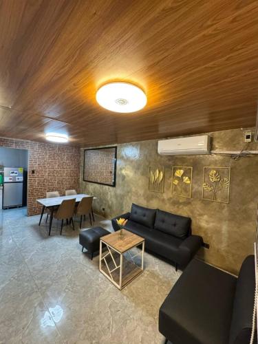 a living room with a couch and a table at Casa Maria Guest House in Angeles