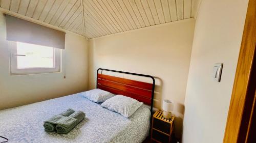 Ένα ή περισσότερα κρεβάτια σε δωμάτιο στο Cozy House with Douro View