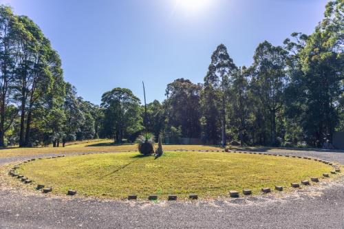 an animal sitting in a circle in a park at Kanimbia Cottages in Coolabine