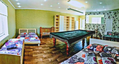 Ένα ή περισσότερα κρεβάτια σε δωμάτιο στο Отель Маленький Рай