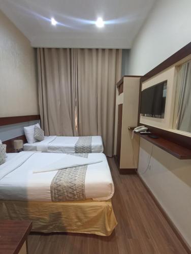 Giường trong phòng chung tại Zad Al Rehab