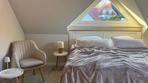 Ένα ή περισσότερα κρεβάτια σε δωμάτιο στο NEU Hütthus Ferienhaus in Timmendorfer Strand