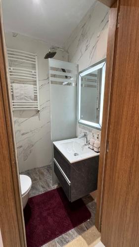 a bathroom with a sink and a toilet at Comfort studio in 'Aïn Benian