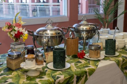 a table with two silver trophies on top of it at The Buccaneer Beach & Golf Resort in Christiansted