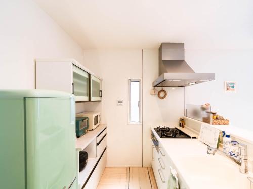 Køkken eller tekøkken på tazuraya-sakuramachi-一棟貸切-無料駐車場