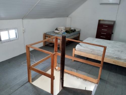 Postel nebo postele na pokoji v ubytování No te pierdas esta linda casa