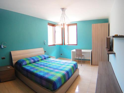 A bed or beds in a room at La Tarantola
