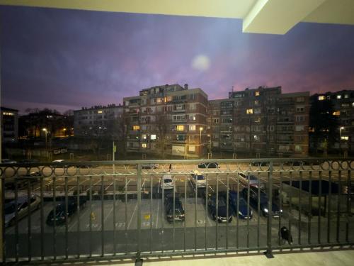 a view of a parking lot in a city at night at I&I Bubanj in Kragujevac