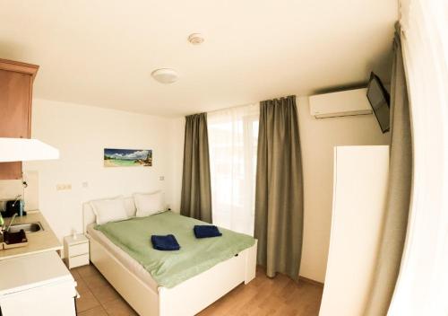 Ένα ή περισσότερα κρεβάτια σε δωμάτιο στο William's apartments - second cozy studio