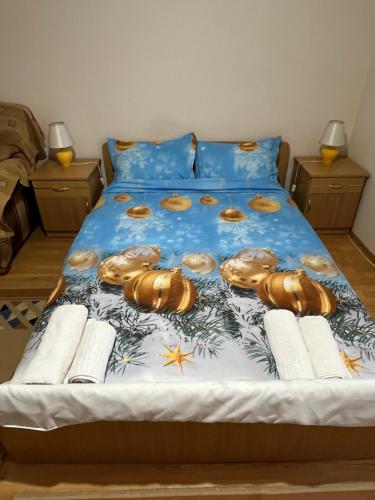 a bed with a bunch of donuts on it at Garsonieră Brazda lui Novac in Craiova