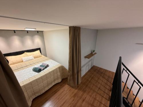 Ένα ή περισσότερα κρεβάτια σε δωμάτιο στο Loft Premium Andradina