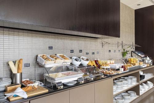 a kitchen with a bunch of food on a counter at B&B Hotel Arezzo in Arezzo