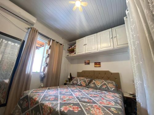 Кровать или кровати в номере Casa de praia da Gi em Gravatá Navegantes a 7km do Beto Carrero e perto da praia